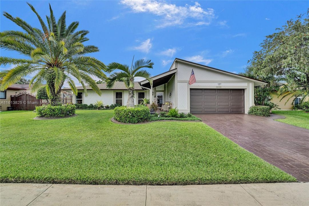 Beautiful Curb Appeal, quiet and tranquil street, Fenced in backyard with a pool, Impact windows and Doors - 2 Car Garage + large driveway