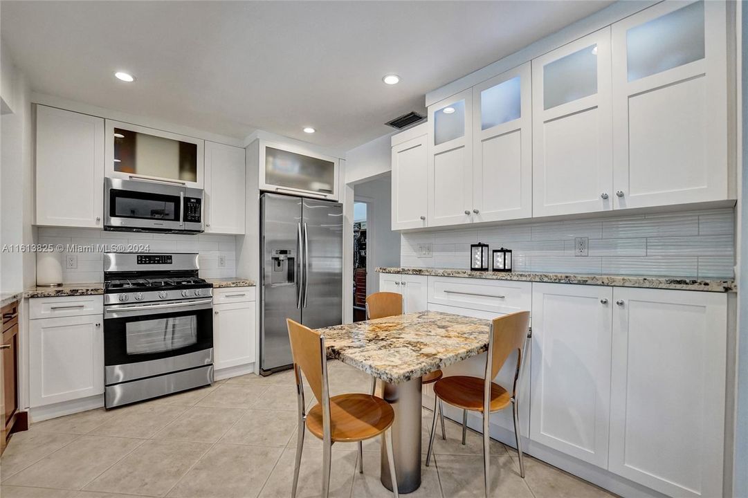 Plenty of storage - Stainless Steel Appliances - Breakfast Table - Recessed Lighting