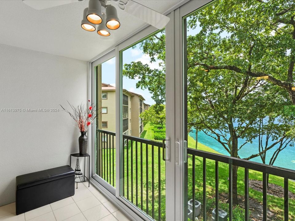 Enclosed balcony with hurricane impact sliding doors