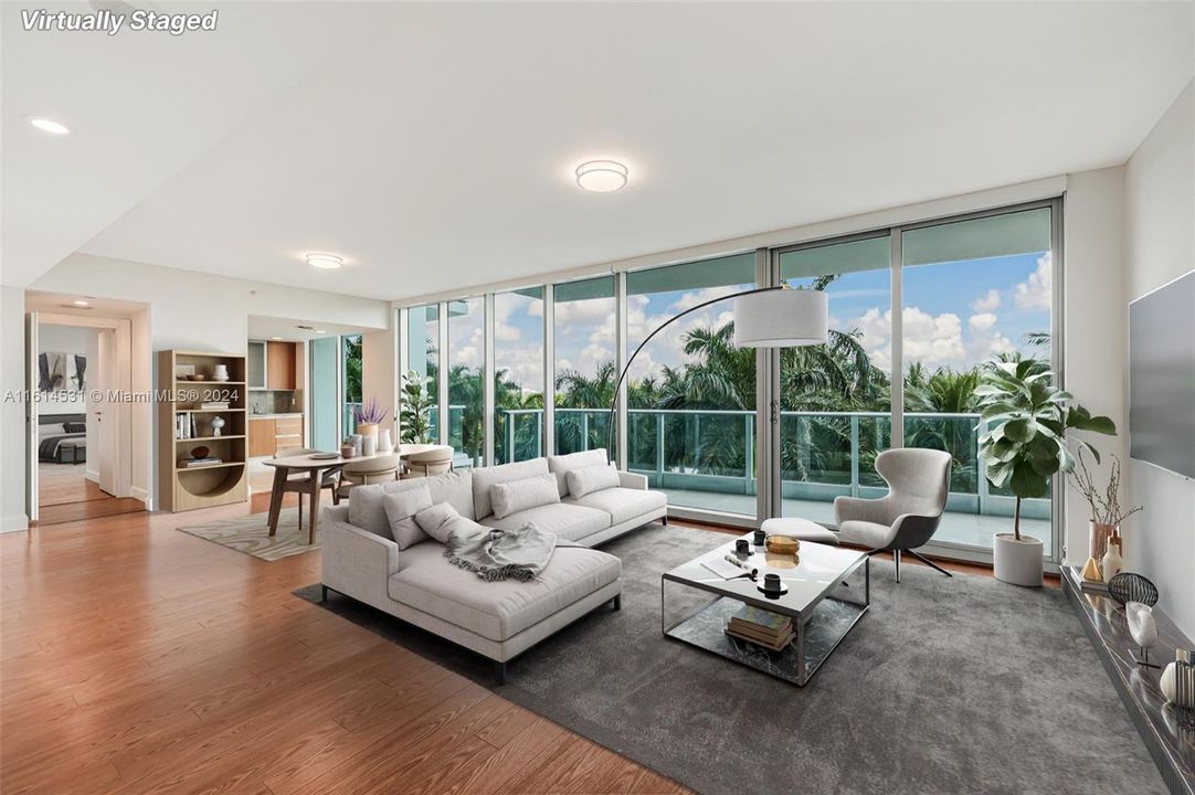 Spacious living room and dining area with floor to ceiling windows that allow for beautiful views of the city scape. Shades included.