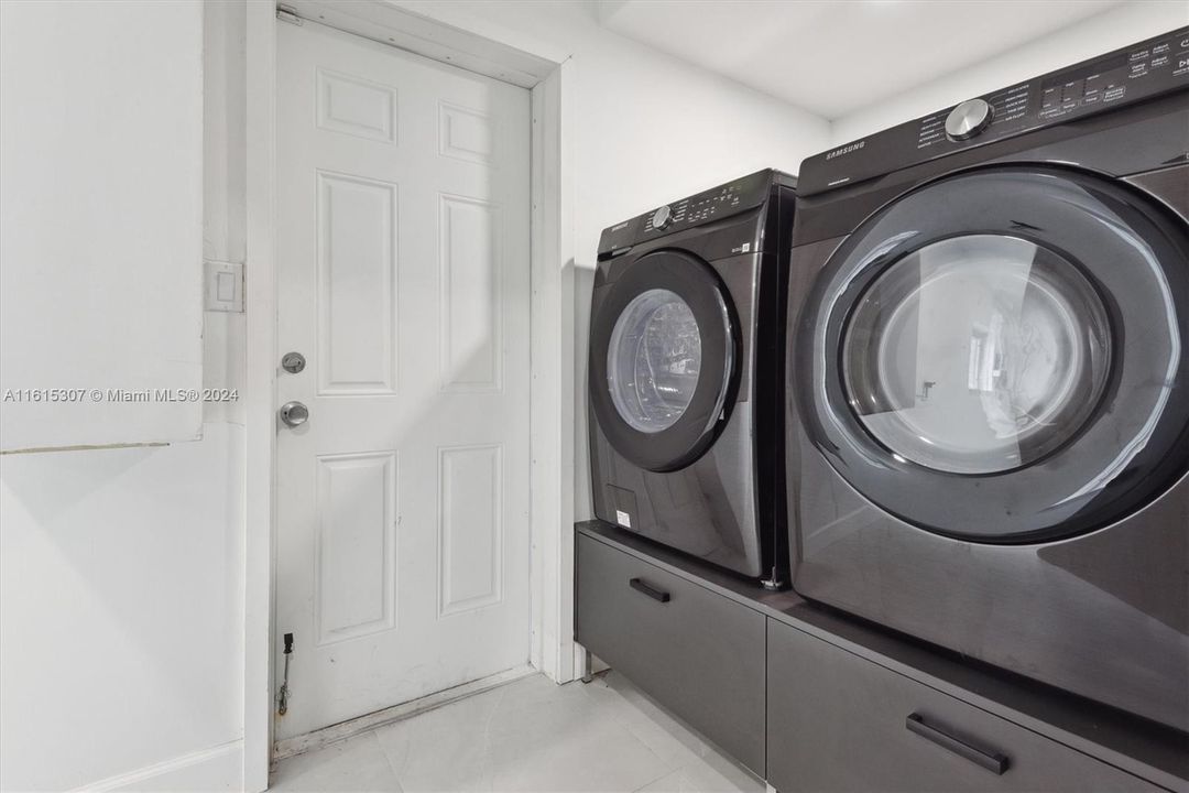 Utility room with an extra fridge & tons of storage space