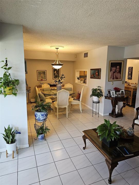 View of dining room and kitchen entrance from living room.