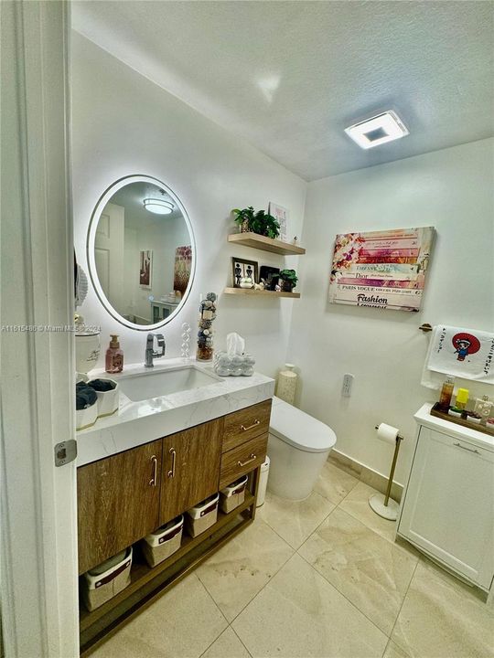 UPGRADED MASTER BATHROOM WITH SEPARATE SHOWER AND JETTED JACUZZI AND MARBLE FLOORS