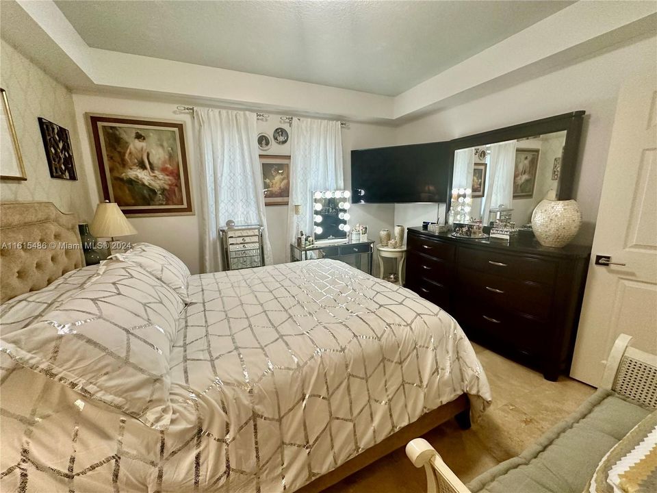 SECOND BEDROOM WITH CUSTOM BUILT WALK-IN CLOSET AND MARBLE FLOORS