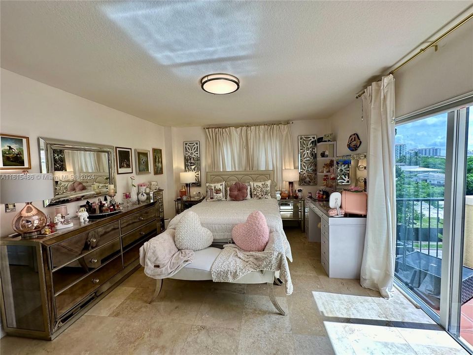 MASTER BEDROOM WITH CUSTOM BUILT WALK-IN CLOSET AND PRIVATE TERRACE