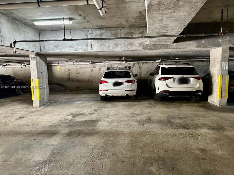 2 COVERED PARKING SPACES SIDE-BY-SIDE IN SECURE GARAGE WITH TV MONITORING CAMERAS