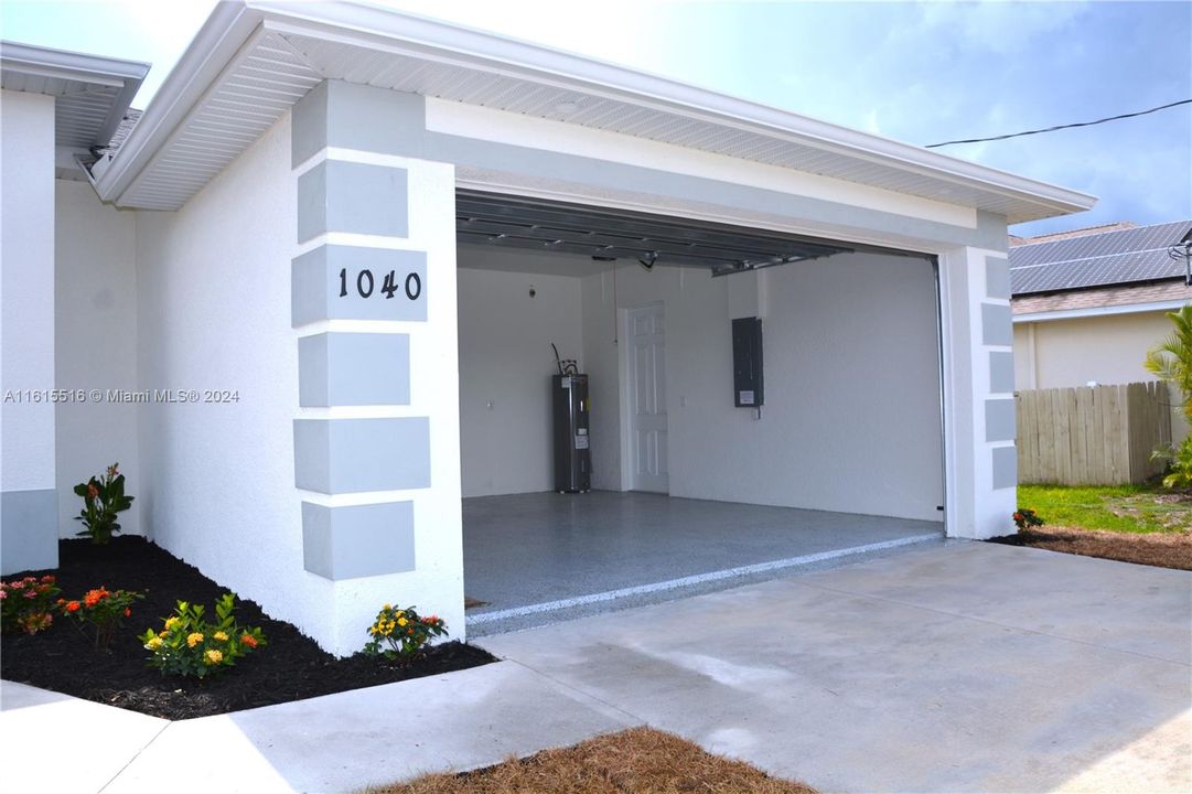 Garage with water heater.