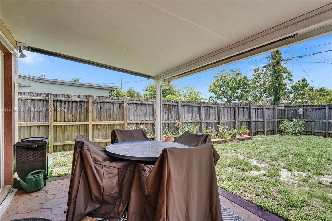 Covered & Screened Patio Area