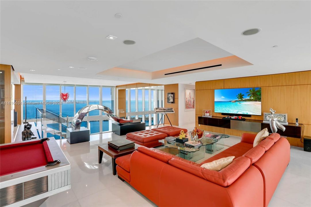 Family room with direct water and city views.