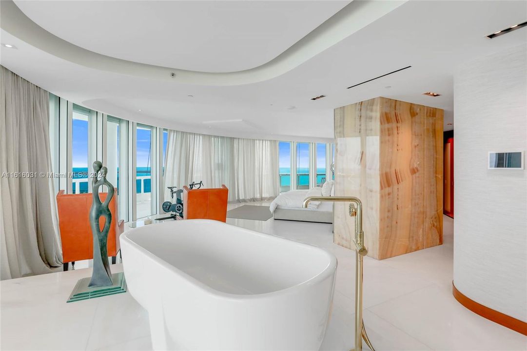 Soaking tub in master bedroom.