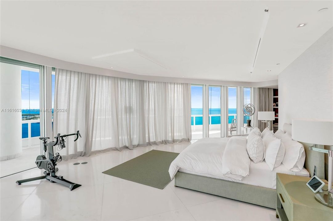 Master bedroom with direct Biscayne Bay and cityscape views.