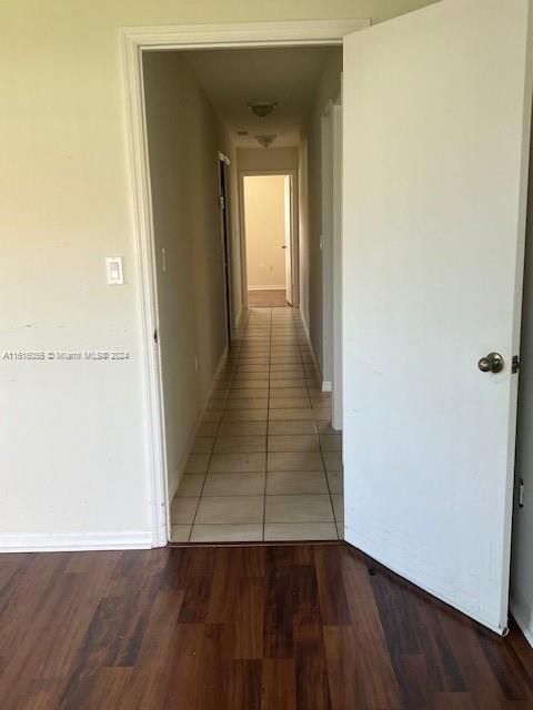 Hallway leads to all bedrooms and hallway bathroom Door leads to Master Bedroom