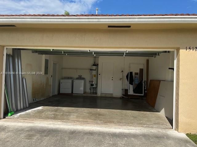 Two Car Garage with Garage Opener Washer Dryer and Water Heater