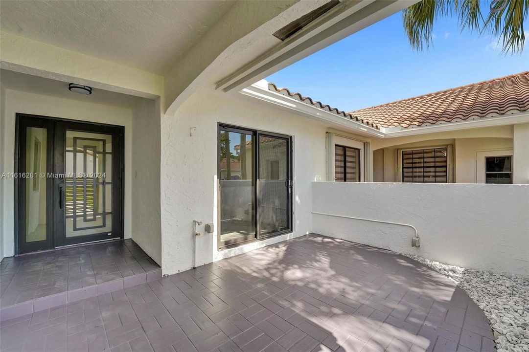 Front patio offers seating space and privacy.