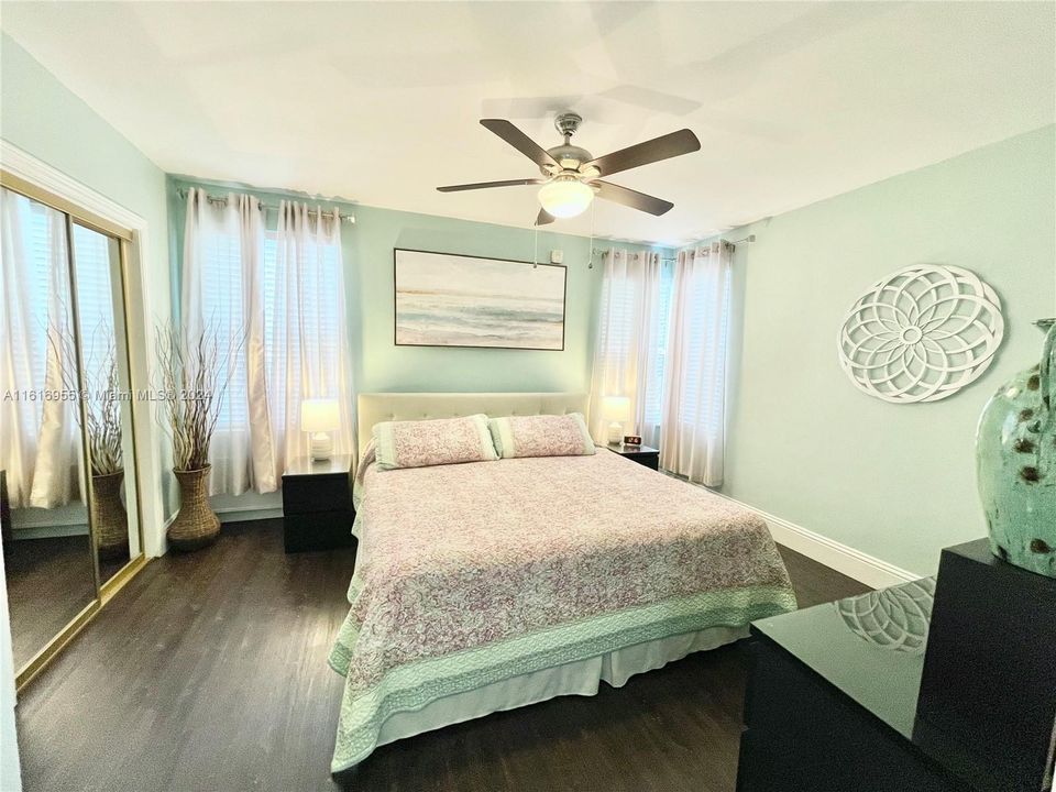 Bedroom features King size bed 2 clossets, side tables and a chest of drawers.