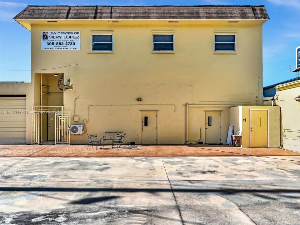 REAR OF BUILDING FENCED AREA