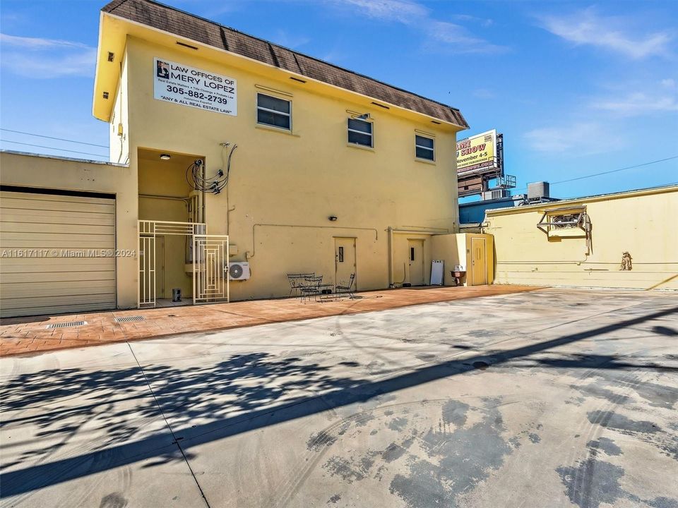 REAR OF BUILDING FENCED AREA