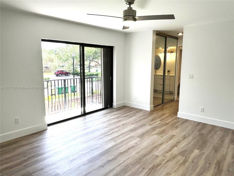 2nd Floor with Balcony looking down to large patio.