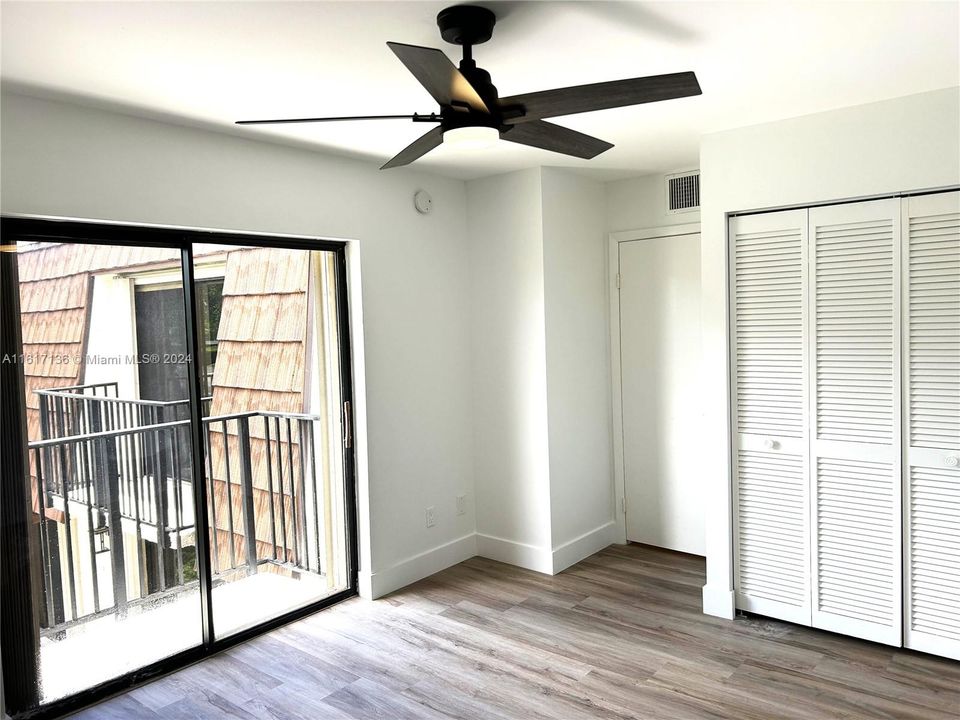 2nd Floor with Balcony looking down to large patio.