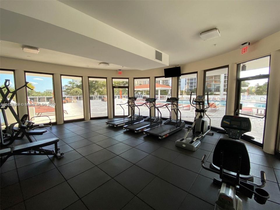 gym with pool view