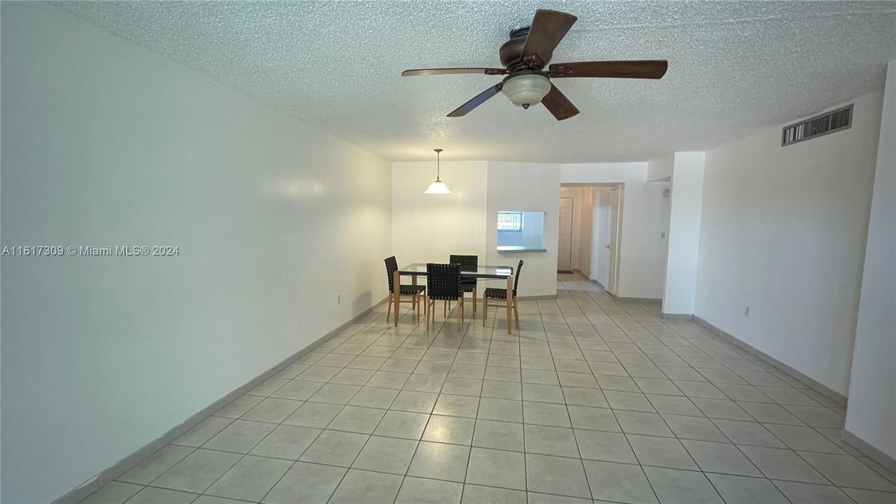 Bright dining living with ceiling fan