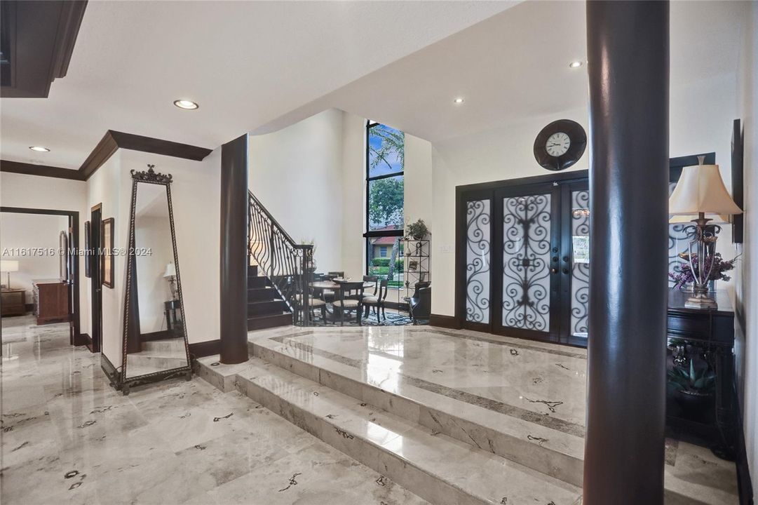 THE FOYER WITH MARBLE FLOORS