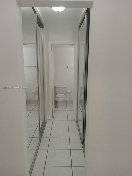 hall to bathroom, 2 mirrored door closets each side