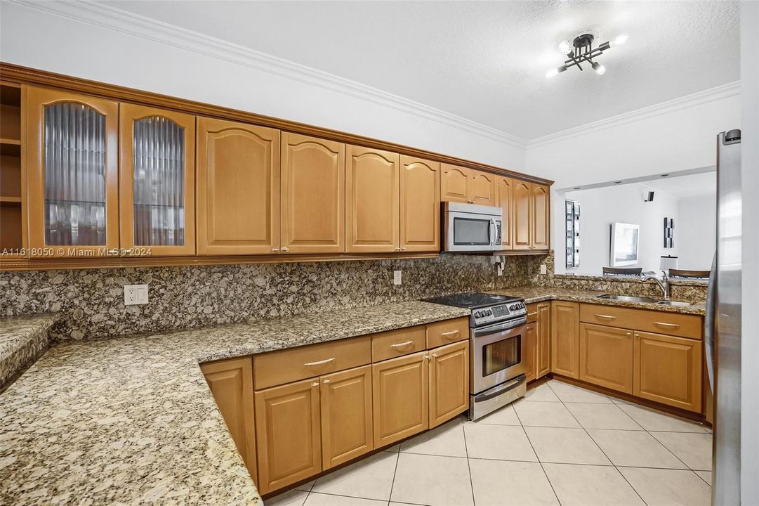 Spacious kitchen! Both sides have eat in counter tops that can seats 7-8 people