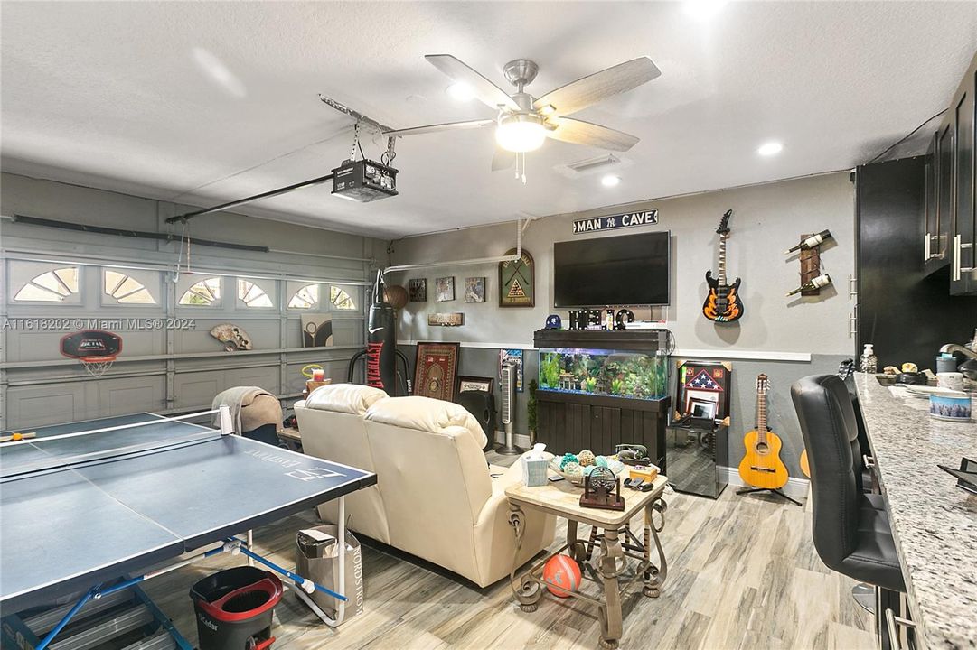 Garage has a finished floor and set up as an entertainment area.