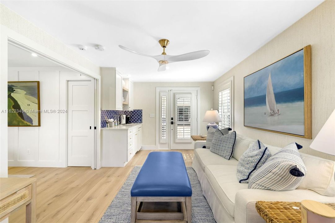 Living area and wet bar in casita; white oak hardwood floors continued through casita