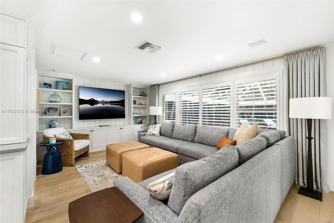 Family Room with built in cabinetry with great storage