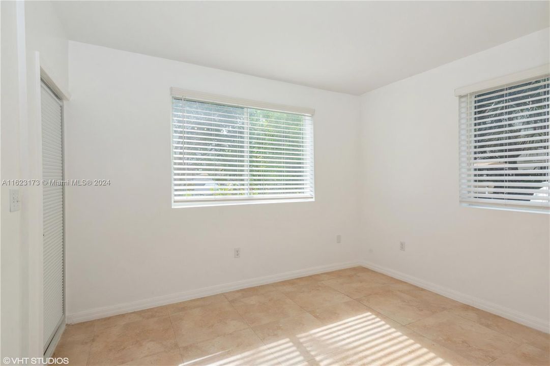 2nd bedroom with access to balcony and tons of natural light