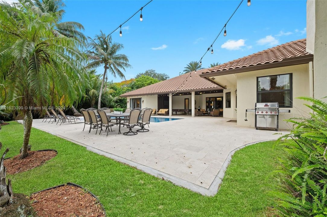 Outdoor living with updated pool and travertine pool deck and patio