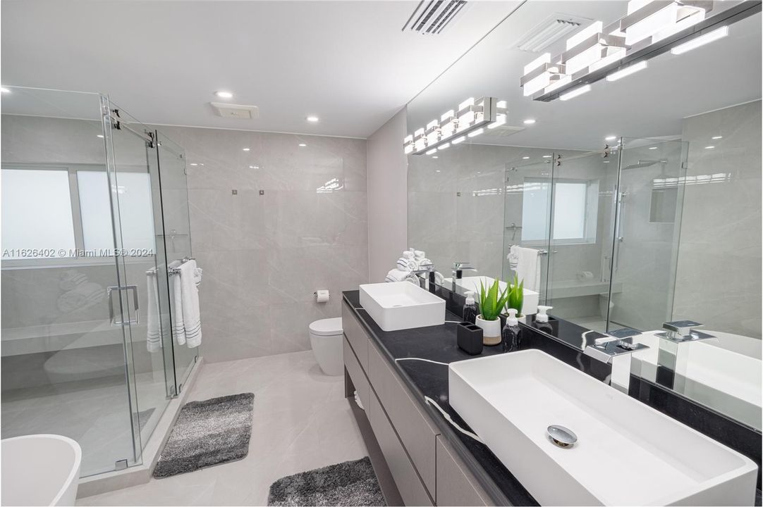 Master bathroom, double vanity, large shower and standalone tub