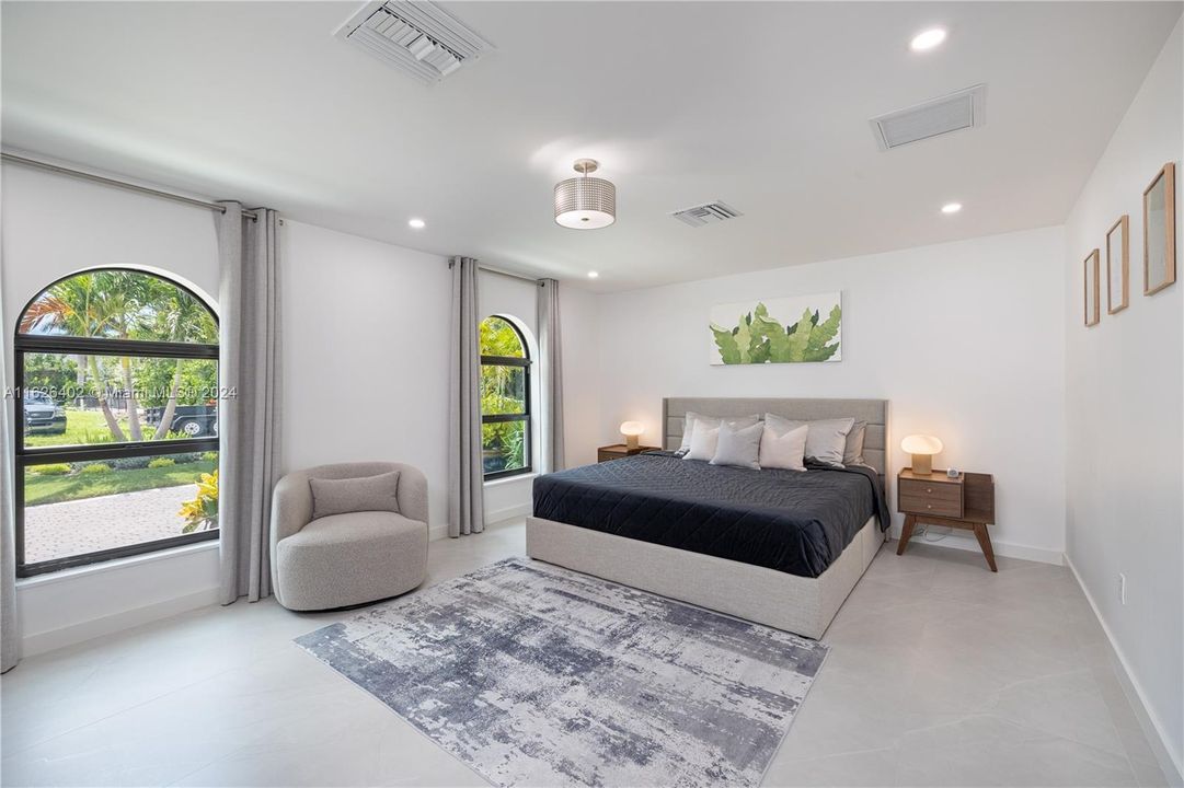 Master bedroom with king size bed with private bathroom