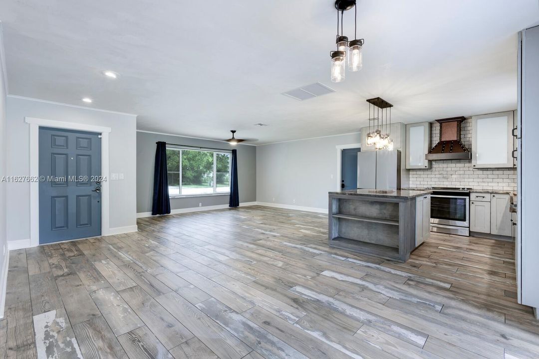 Front door, living room & kitchen