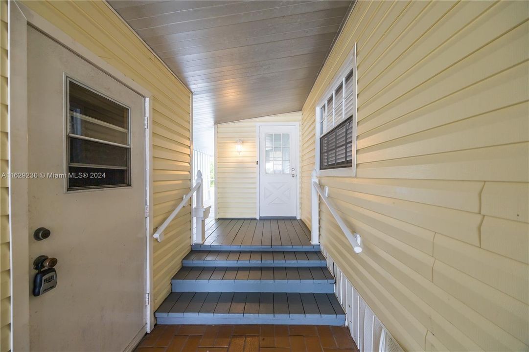 Covered Entrance w/ Storage Shed