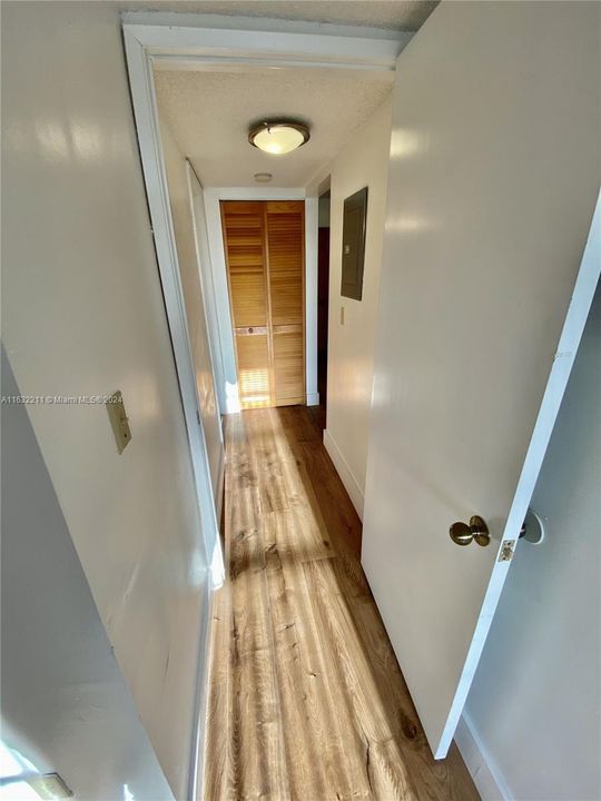 Extra closet space on hallway going towards the 2nd bedroom
