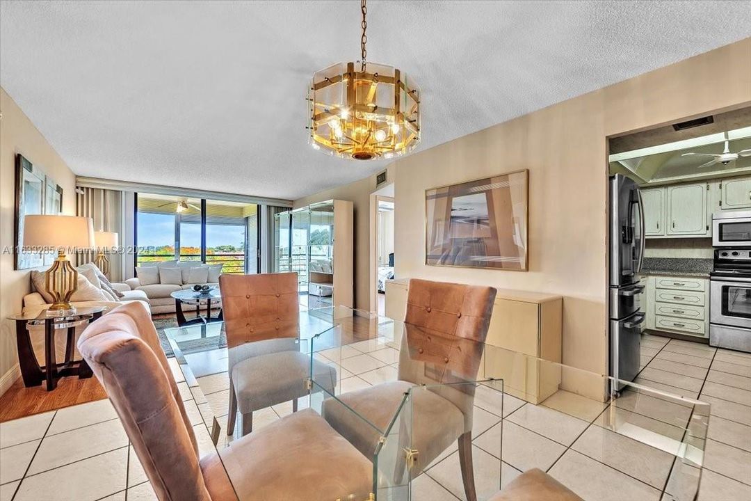 Dining overlooking into kitchen and living area