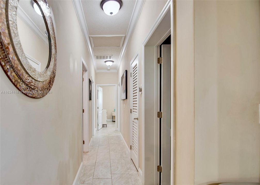 Hallway to laundry room and bedrooms & bathrooms