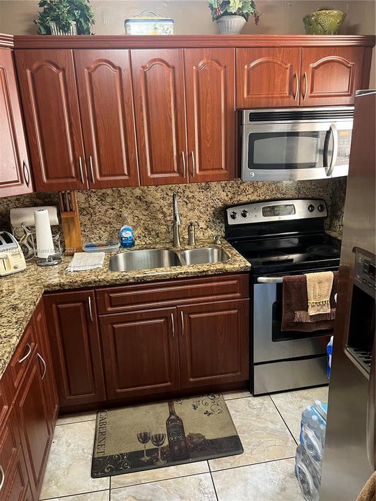 Stainless steel appliance and updated kitchen.