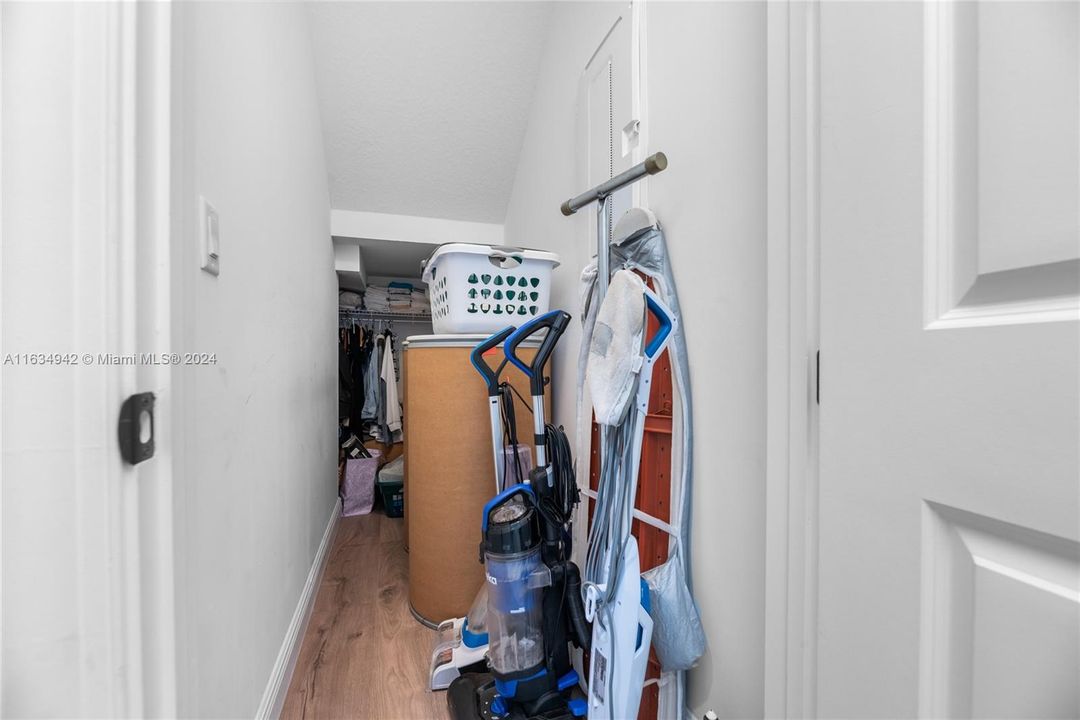 Under stairs storage, upgraded wood floor throughout