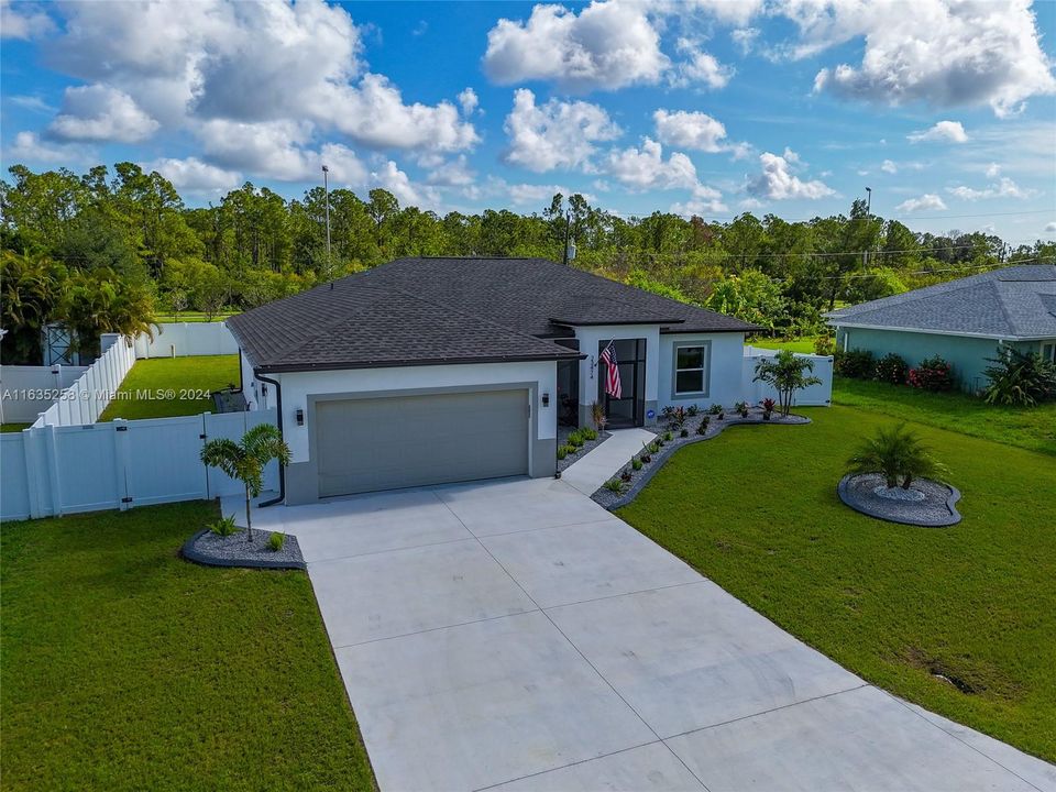 2 car garage and a large driveway that fits at least 4 more vehicles.