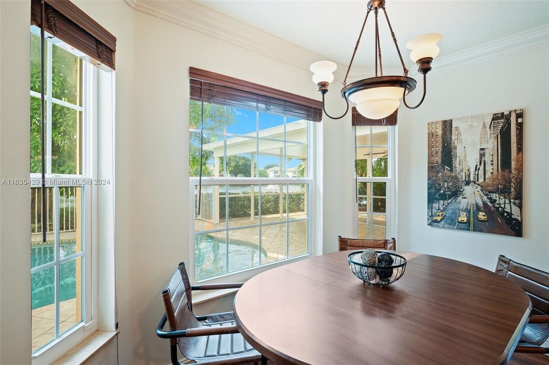 Breakfast area overlooks the salt water pool patio and lake!