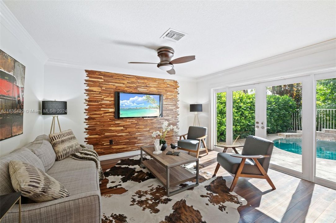 Decorator features in the Family Room which overlooks the pool and patio.