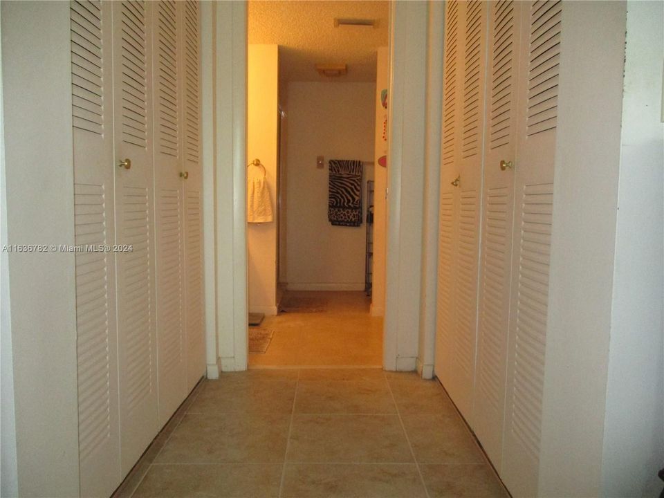 Master bedroom has  closets on both sides of hallway