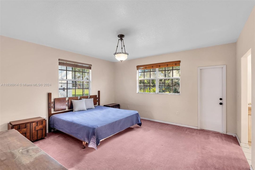 Large Master Bedroom, door opens to backyard.