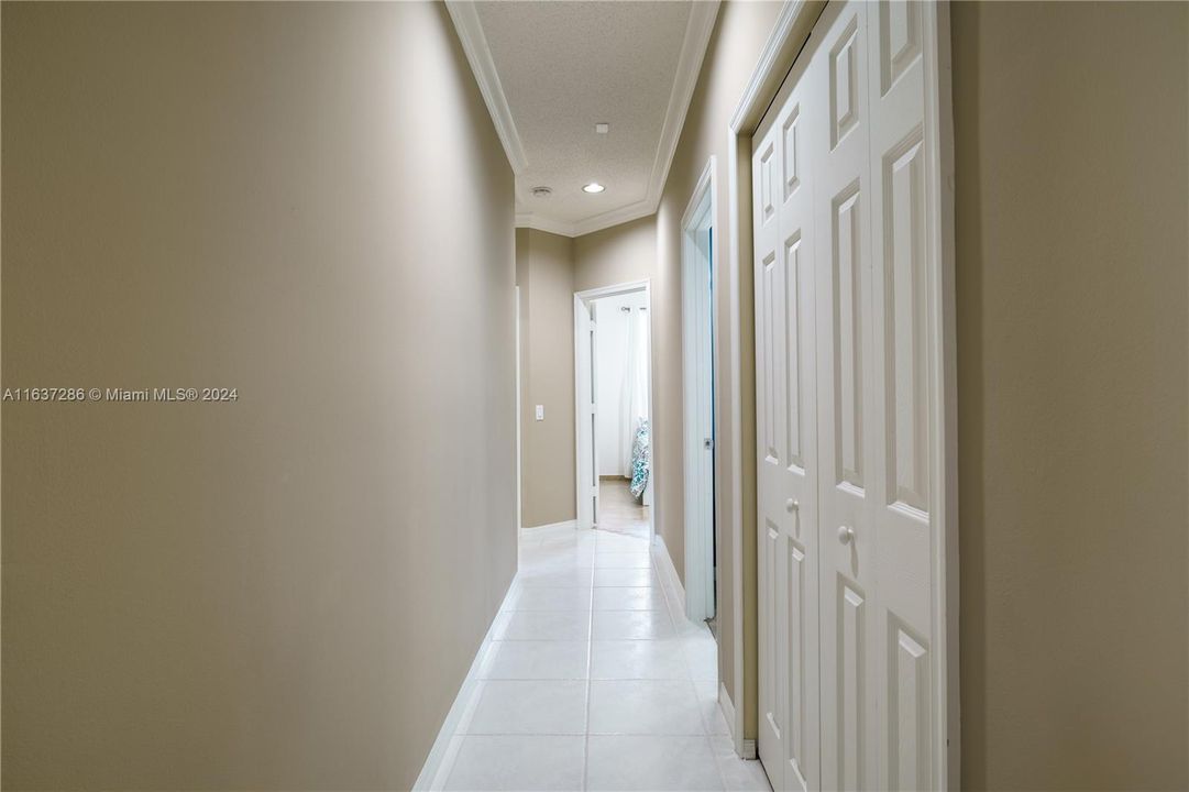 Hallway leading to three bedrooms