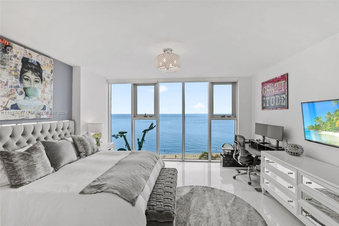 Primary Bedroom with direct ocean views, walk in closets with custom cabinetry