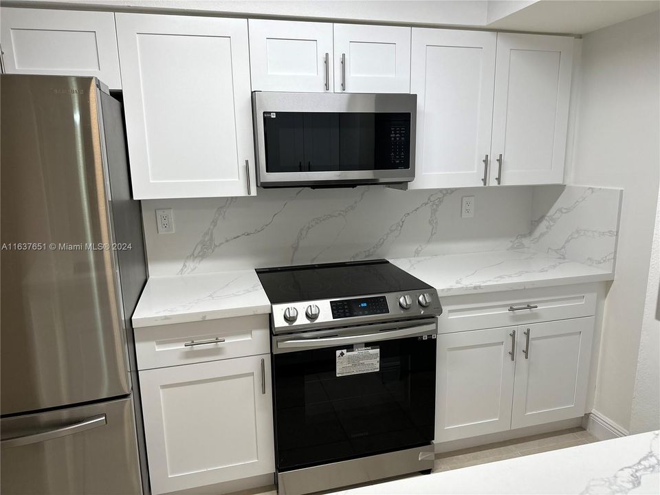 Brand new kitchen - marble counter tops, cabinets, & stainless steel appliances.